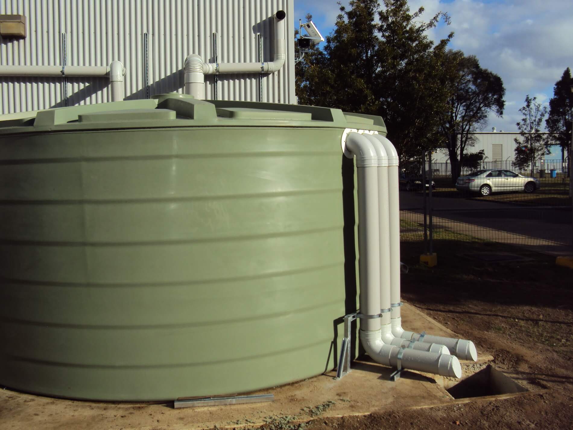 Rainwater harvesting, pumping and treatment for reuse in flushing toilets